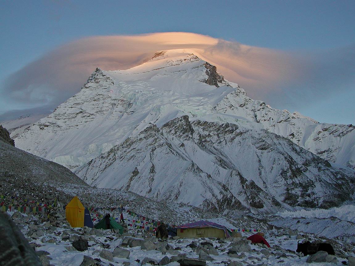 A mountain with a cloud of light

Description automatically generated