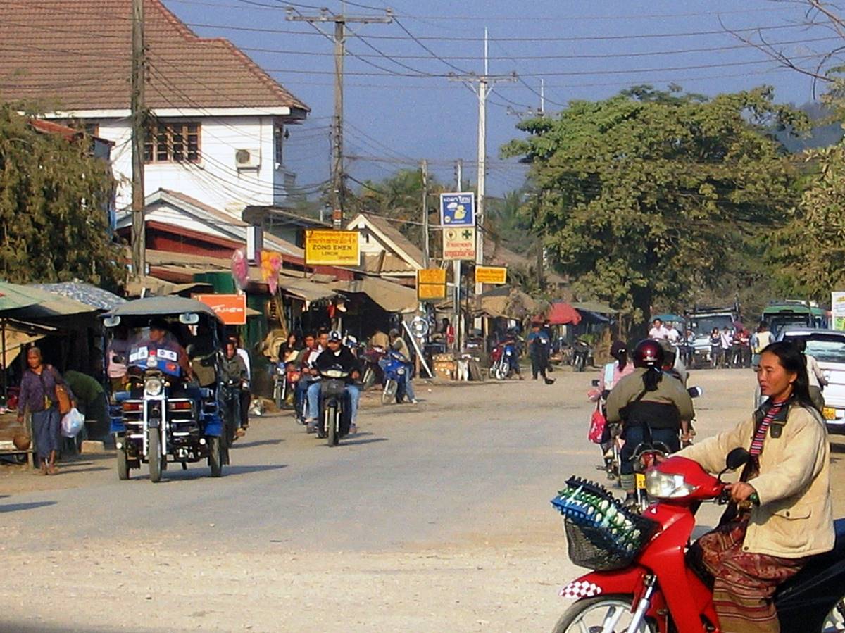 A group of people riding motorcycles on a street

Description automatically generated