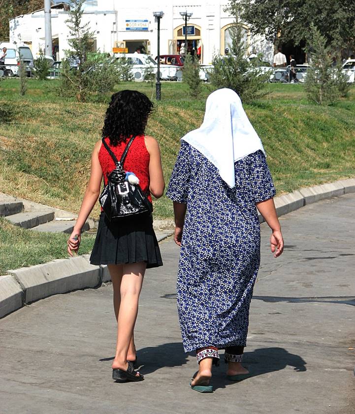 Women walking on a sidewalk

Description automatically generated