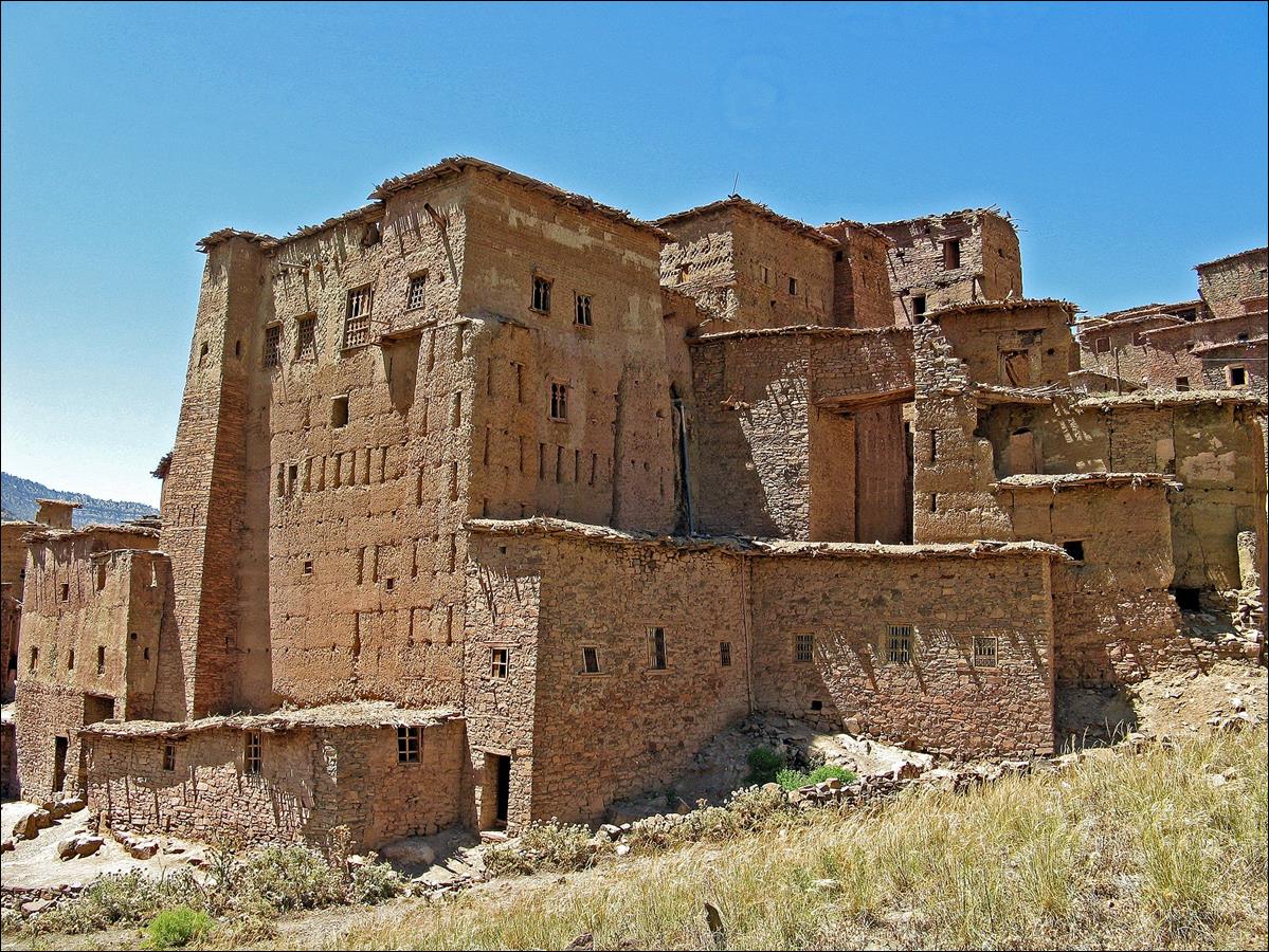 A stone building with many windows with Hopi House in the background

Description automatically generated