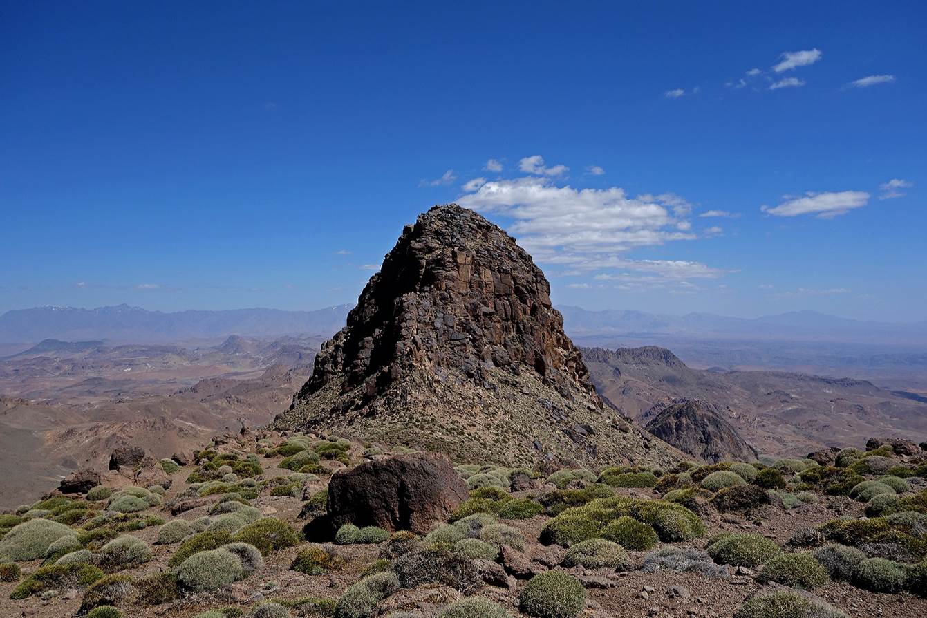 A mountain with a rocky peak

Description automatically generated with medium confidence