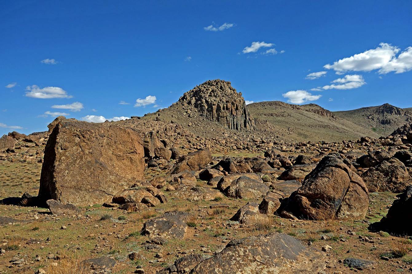 A rocky landscape with blue sky

Description automatically generated
