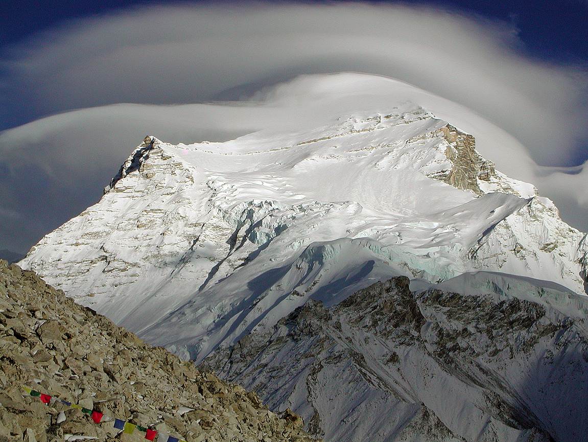 A mountain with a cloud formation

Description automatically generated