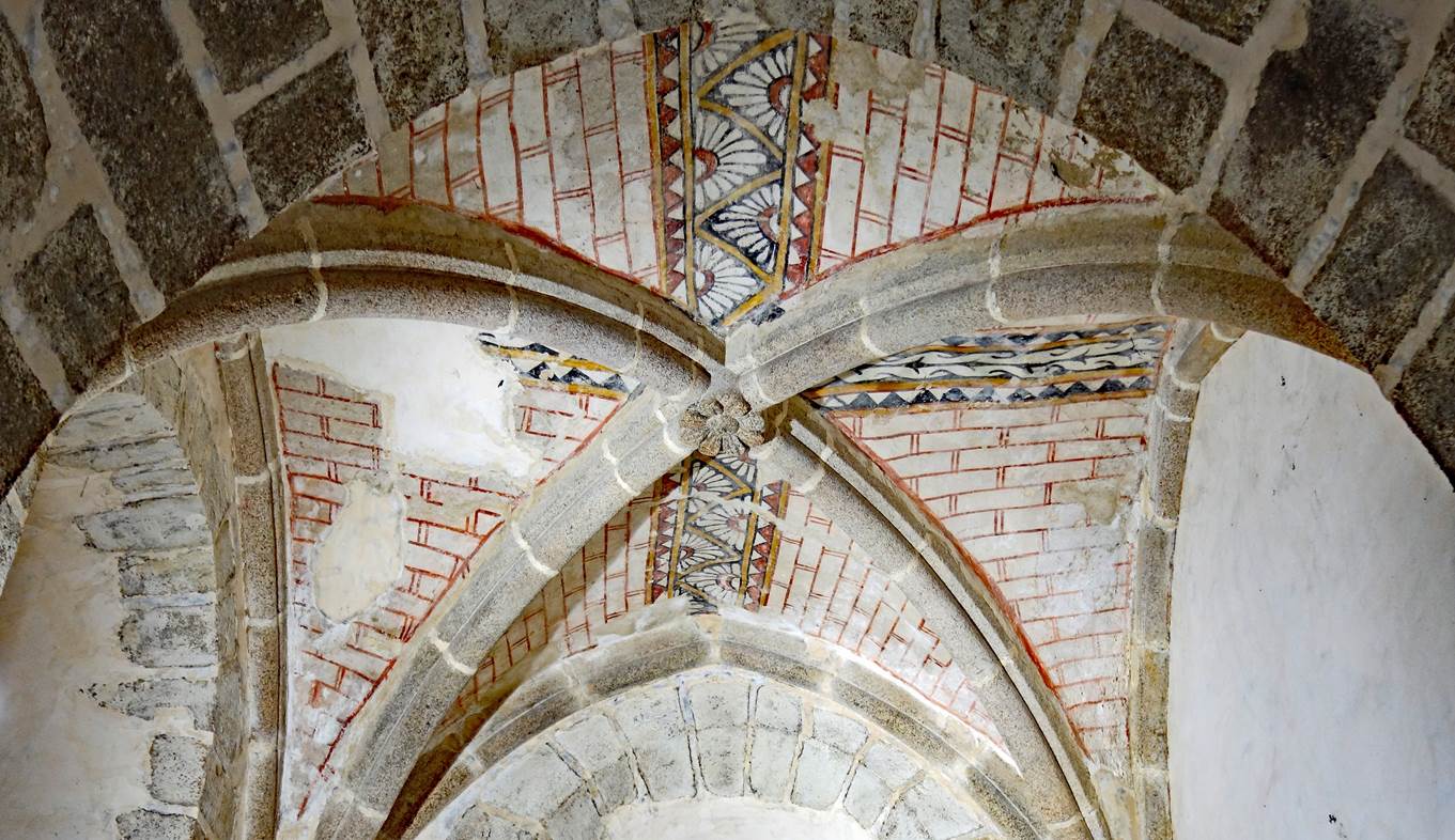 A close-up of a stone ceiling

Description automatically generated