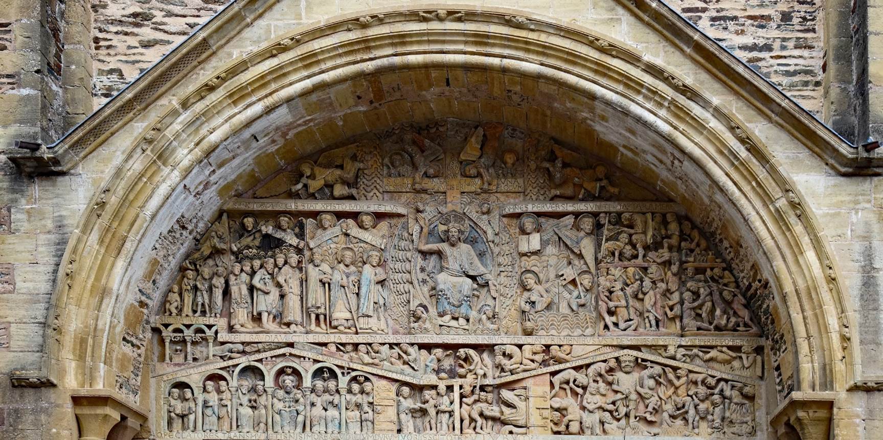 A stone carving of people in a building

Description automatically generated with medium confidence