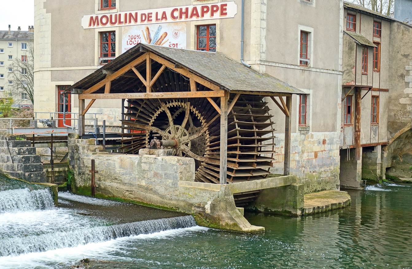 A picture containing building, outdoor, water, water mill

Description automatically generated