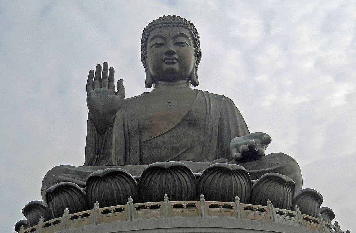 A large statue of a buddha with Lantau Island in the background

Description automatically generated