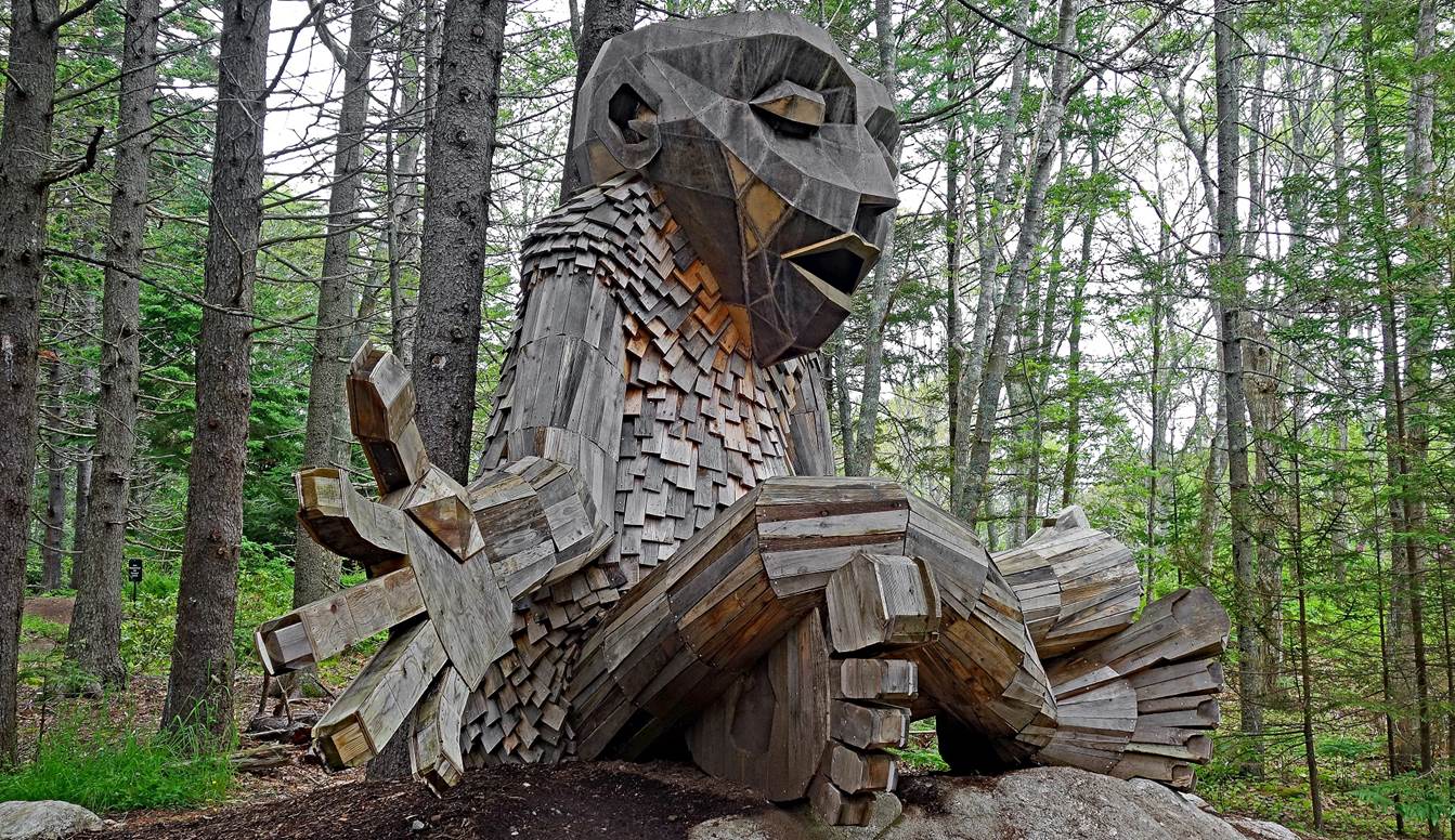 A picture containing tree, outdoor, sculpture, chainsaw carving

Description automatically generated